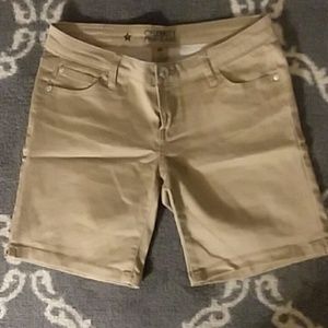 Khaki mid shorts.